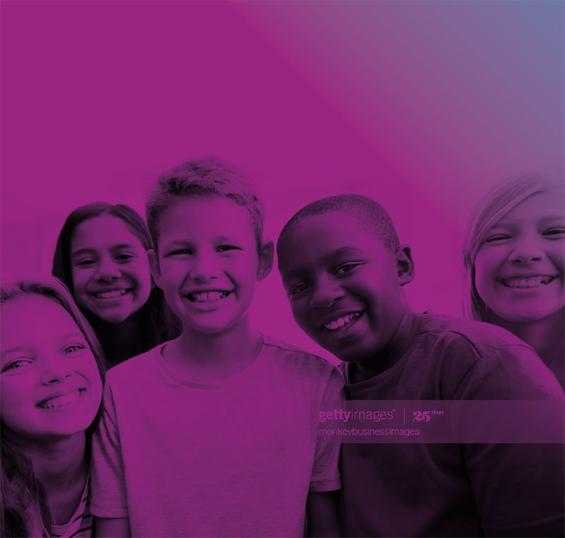 Group of kids together smiling.
